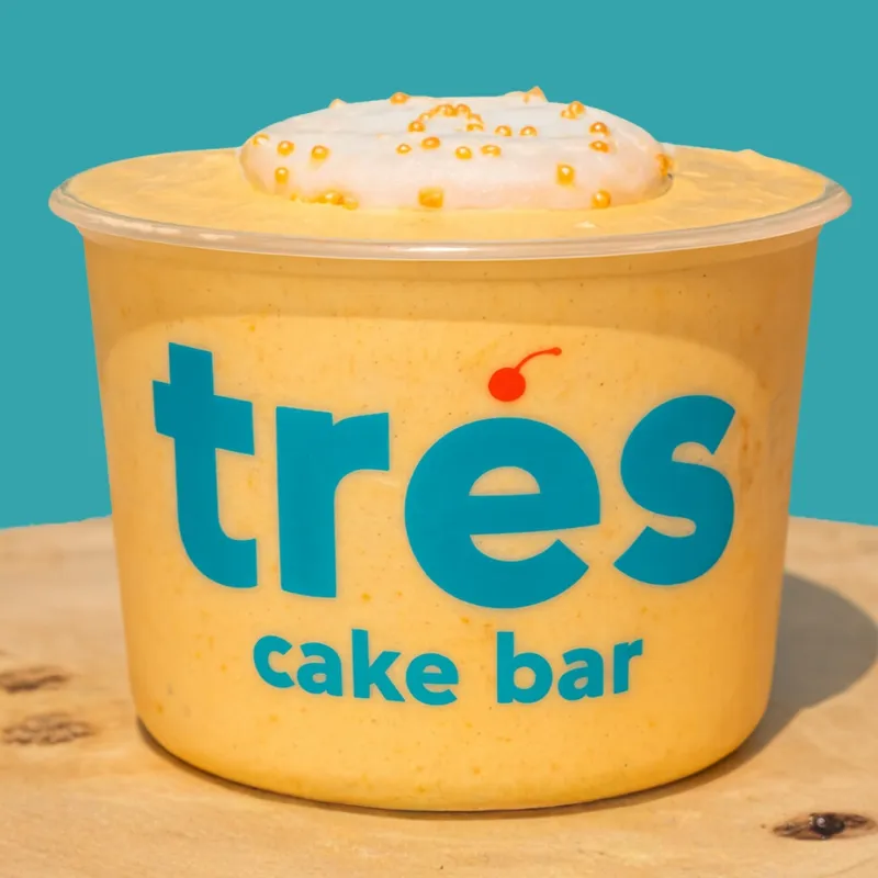 Pumpkin spice tres leches cup with whipped cream